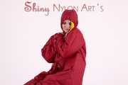 Watching sexy Jill wearing a sexy yellow shiny nylon rainwearcombination and a red shiny nylon raincoat posing for you (Pics)