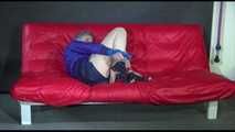 MARA tied and gagged with gymnastics bands and a ball gag - hand to feet wearing a supersexy shiny nylon shorts and rain jacket (Video)