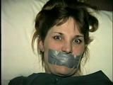 26 Yr OLD BARMAID IS BOUND, MOUTH STUFFED, HANDGAGGED & TAPE GAGGED (D27-2)