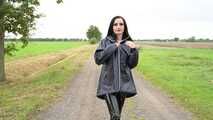 Miss Amira in blue Hunter rain jacket and patent leggings