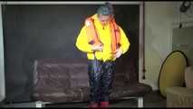 Watching Mara putting on a down jacket, rubber boots and a lifevest (Video)