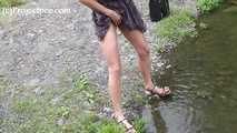 119018 Donna-Jo Takes A Relaxed Pee Into The Small Stream.