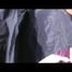 03:30 Min. video with Katharina tied and gagged in two layers of shiny nylon rainwear