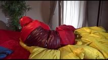 Jill ties, gagges and hoodes herself with cuffs wearing a sexy red shiny nylon down jacket and rain pants (Video)