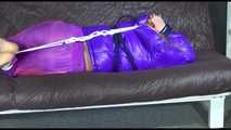 ***HOT SANDRA*** tied, gagged and hooded with ropes and a cloth gag on bed wearing a sexy purple shiny nylon down jacket and a rain pant (Video)