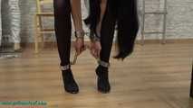 Nina heavyly cuffed to the bed