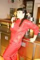 Jill posing sexy in an bar wearing sexy red shiny nylon rainwear (Pics)