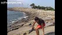 016169 Eve Takes A Discrete Pee On The Rocks