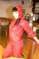 Jill posing sexy in an bar wearing sexy red shiny nylon rainwear (Pics)