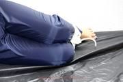 Shelly tied and gagged in shiny nylon pants and a shiny nylon dowjacket