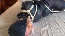 Rachel Adams tied and gagged in Rainwear