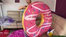 overinflate various pool toys until they burst and sign them