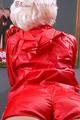 Blonde archive girl posing infront of a mirror wearing sexy red shiny nylon shorts and a red rain jacket (Pics)