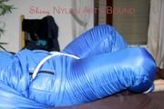 Jill tied, gagged and hooded on bed wearing a supersexy supershiny lightblue downwear (Pics)