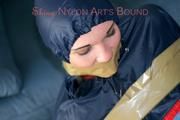 Jill tied, gagged and hooded on the floor with tape wearing an oldschool rain combination (Pics)