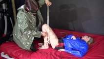Watching sexy SONJA being tied and gagged with ropes and a clothgag by another girl on the bed both wearing sexy shiny nylon clothes (Video)