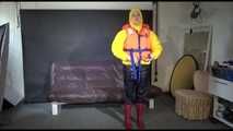 Watching Mara putting on a down jacket, rubber boots and a lifevest (Video)
