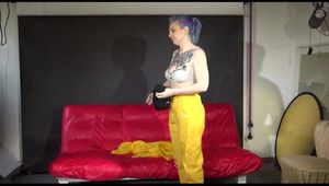 Watching Mara putting on sexy yellow shiny nylon rainwear lolling on the sofa (Video)