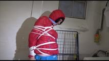 Mara tied, gagged and hooded in a laundry wearing a sexy blue down pants and a red down jacket (Video)