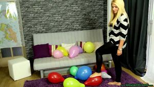 barefeet popping of party balloons