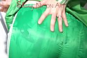 Sonja oiling and rinsing herself in the shower wearing a supersexy green shiny nylon shorts and rain jacket (Pics)