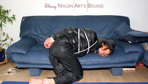Katharina tied and gagged in nylon pants and a shiny black down jacket