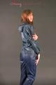 Alina posing in a studio wearing a supersexy darkblue rainwear combination (Pics)