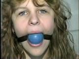 19 Yr OLD SINGLE MOM RONI IS WRAP CLEAVE GAGGED WITH AN ACE BANDAGE, HANDGAGGED, MOUTH STUFFED, BALL-GAGGED & TIED BACKWARDS TO A CHAIR (D53-9)
