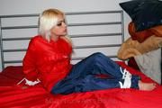 Nina tied and gagged in shiny nylon rainwear