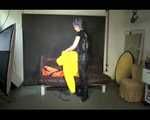 Sexy Mara trying on her new yellow down jacket and her lifevest in combination with a sexy shiny black rain pants and rubber boots (Video)