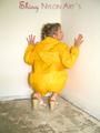 Leonie wearing a super sexy yellow rainwear combination posing outdoor (Pics)
