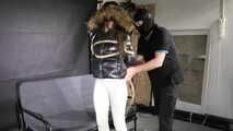 Marie bound and gagged in a shiny nylon Downjacket