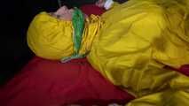 Watching sexy Pia being tied and gagged with ropes on a bed and a clothgag wearing sexy yellow shiny nylon rainwear (Video)