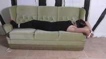 Aurora roped on couch 2/2