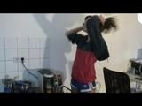 Alina sitting in front of the PC, on a sofa and ind the kitchen wearing different kind of sexy shiny nylon shorts and rain jackets (Video)