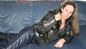 Petra lolling on the sofa wearing a sexy blue rainwear combination (Pics)