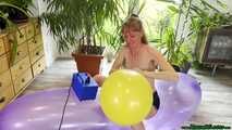 topless inflating balloons with the pump and popping them with the lighter