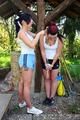 Jill tied and gagged by her friend in shiny shorts
