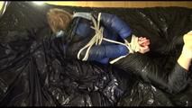 Pia tied, gagged and hooded lying on a bed with shiny nylon cloth wearing a sexy black adidas nylon pants and a blue down jacket(Video)