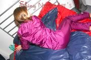 Alina preparing her bed for relaxing and lolling on the bed wearing a sexy shiny nylon rain pants and a rain jacket (Pics)