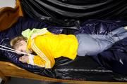 Samanthy bound and gagged in shiny nylon rainwear