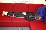 Samantha bound and gagged in shiny nylon rainwear