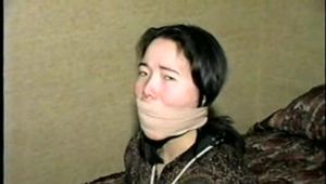 25 YEAR OLD ASIAN MAI-LING IS BALL-TIED, MOUTH STUFFED, BAREFOOT, TOE-TIED, FOOT TICKLED, WRAP ACE BANDAGE GAGGED & CLEAVE GAGGED (D56-1)