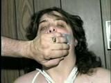BIG.314 POUND BARBARA IS HANDGAGGED, MOUTH STUFFED, TAPE GAGGED & TIED WRISTS (D37-4)