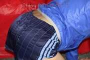 Watching sexy Sonja wearing a supersexy oldschool blue shiny nylon shorts and a lightblue rain jacket during her workout with barbells (Pics)
