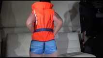 Sexy Jill shows you how to enjoy putting on and wear a lifevest over an bikini and a shiny nylon shorts (Video)
