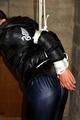 Julia tied and gagged in down jacket (cellar)
