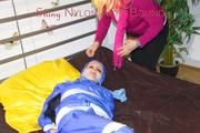 Lucy taped, hooded and gagged on bed wearing sexy blue rainwear (Pics)