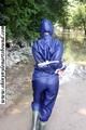 Stella bound outdoor in a blue rainsuit