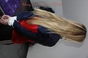 Samantha tied and gagged on bed wearing shiny nylon rainwear (Pics)